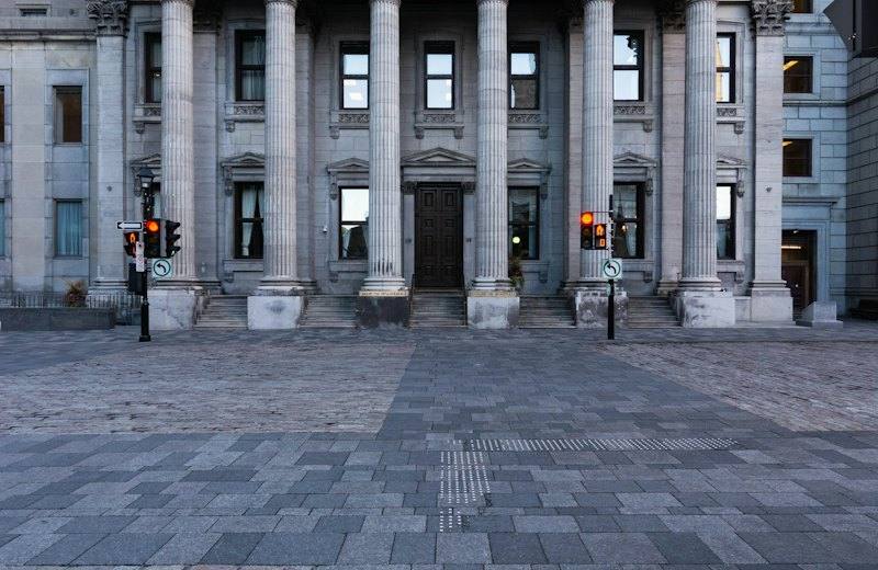 Neoclassical bank building facade with stone columns