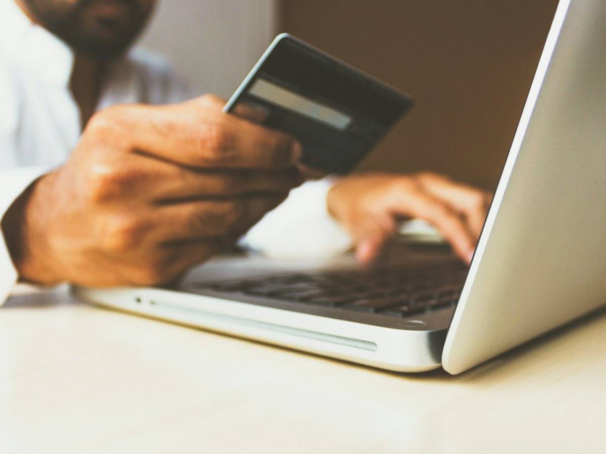 Customer entering card details on a laptop during an online payment