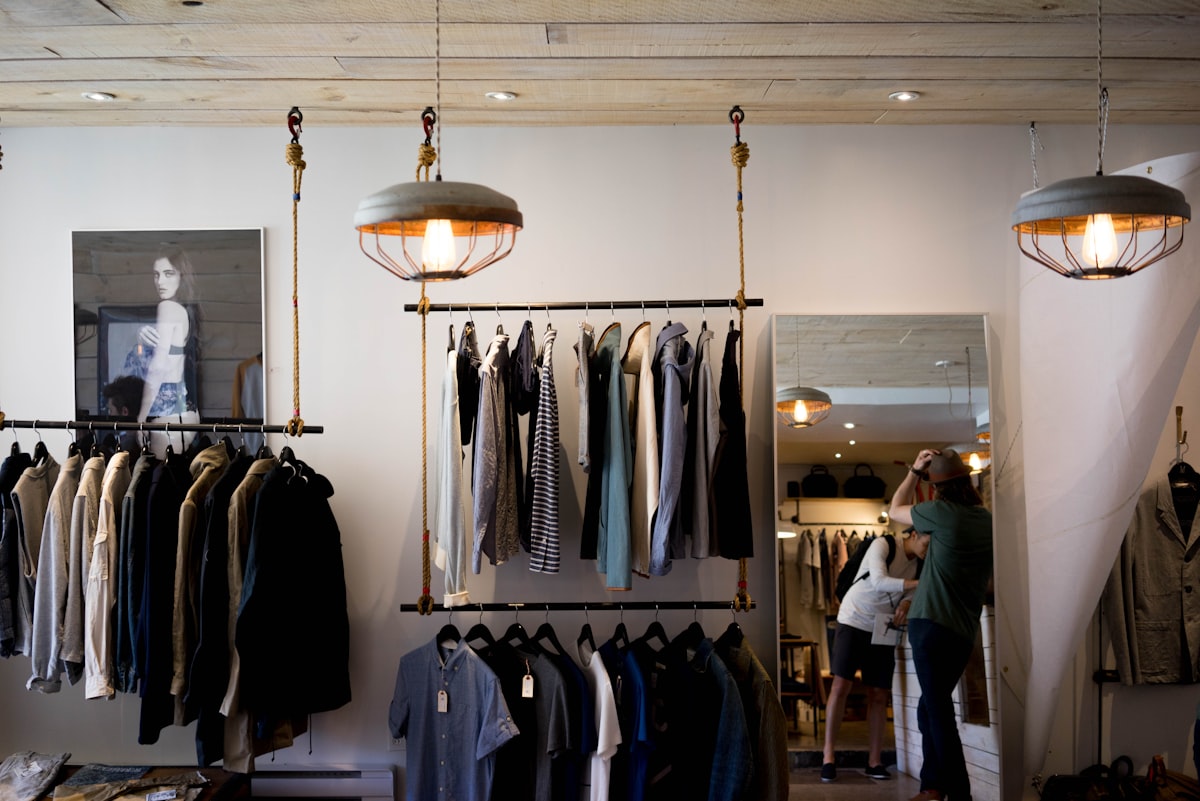 A fashion boutique's clothing racks and fitting area
