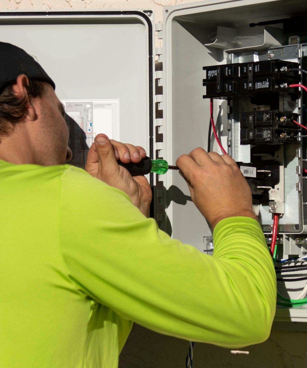 Technician installing monitoring equipment during deployment