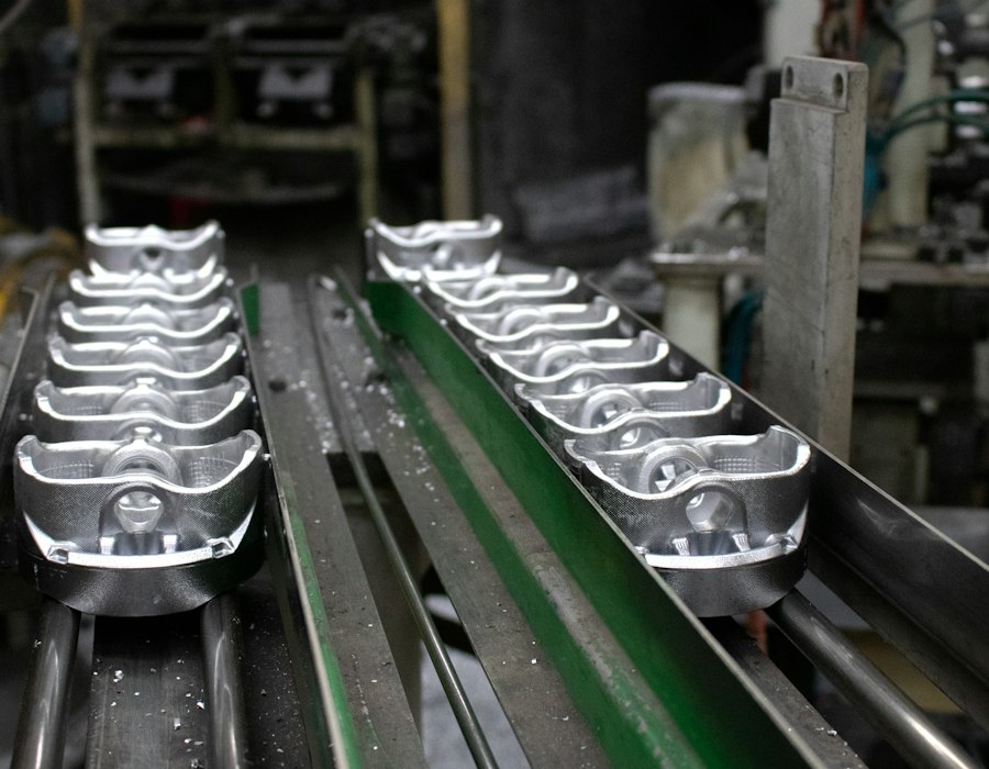 Machined parts moving along a production line conveyor