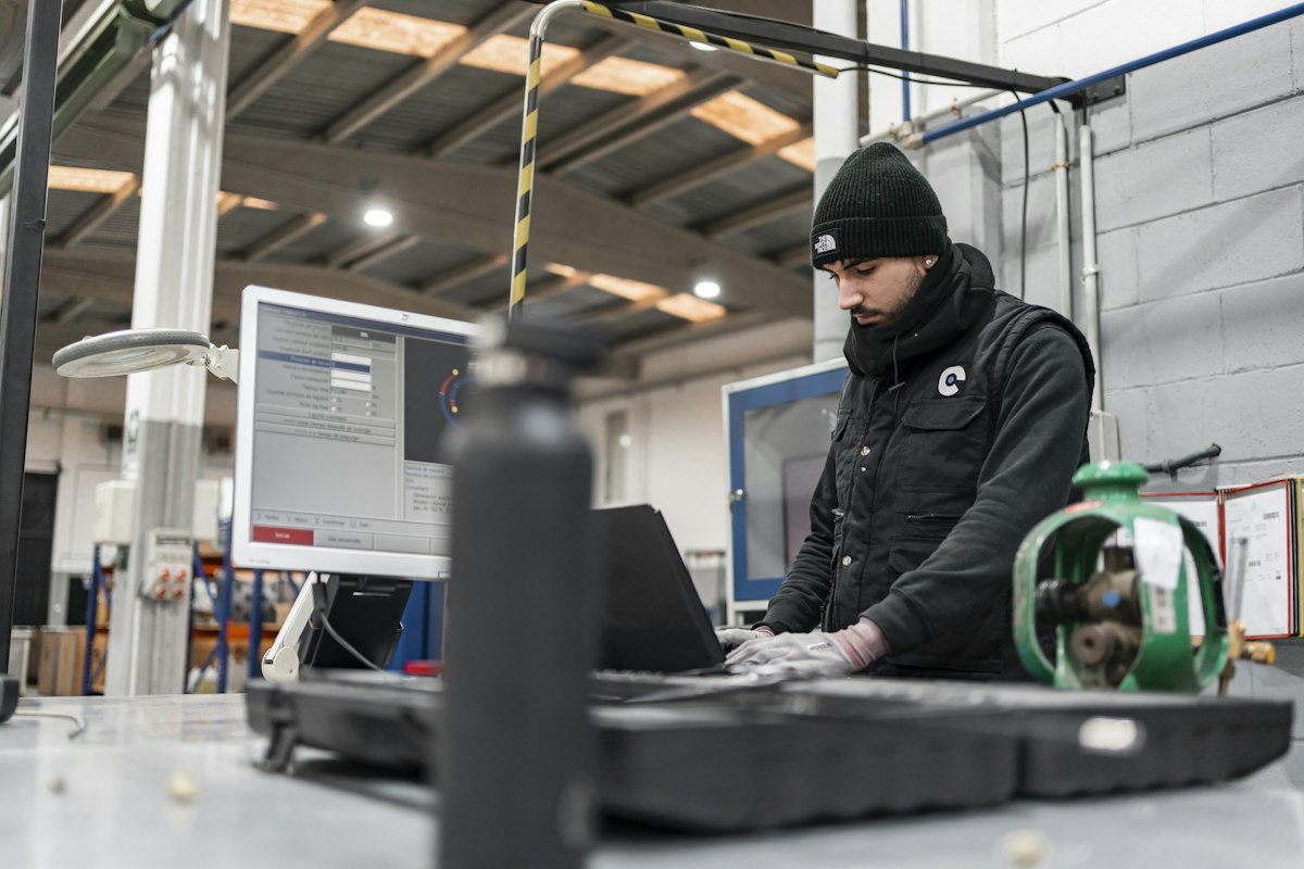 Manufacturing engineer reviewing live production data on the shop floor